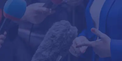 hands in front of microphones