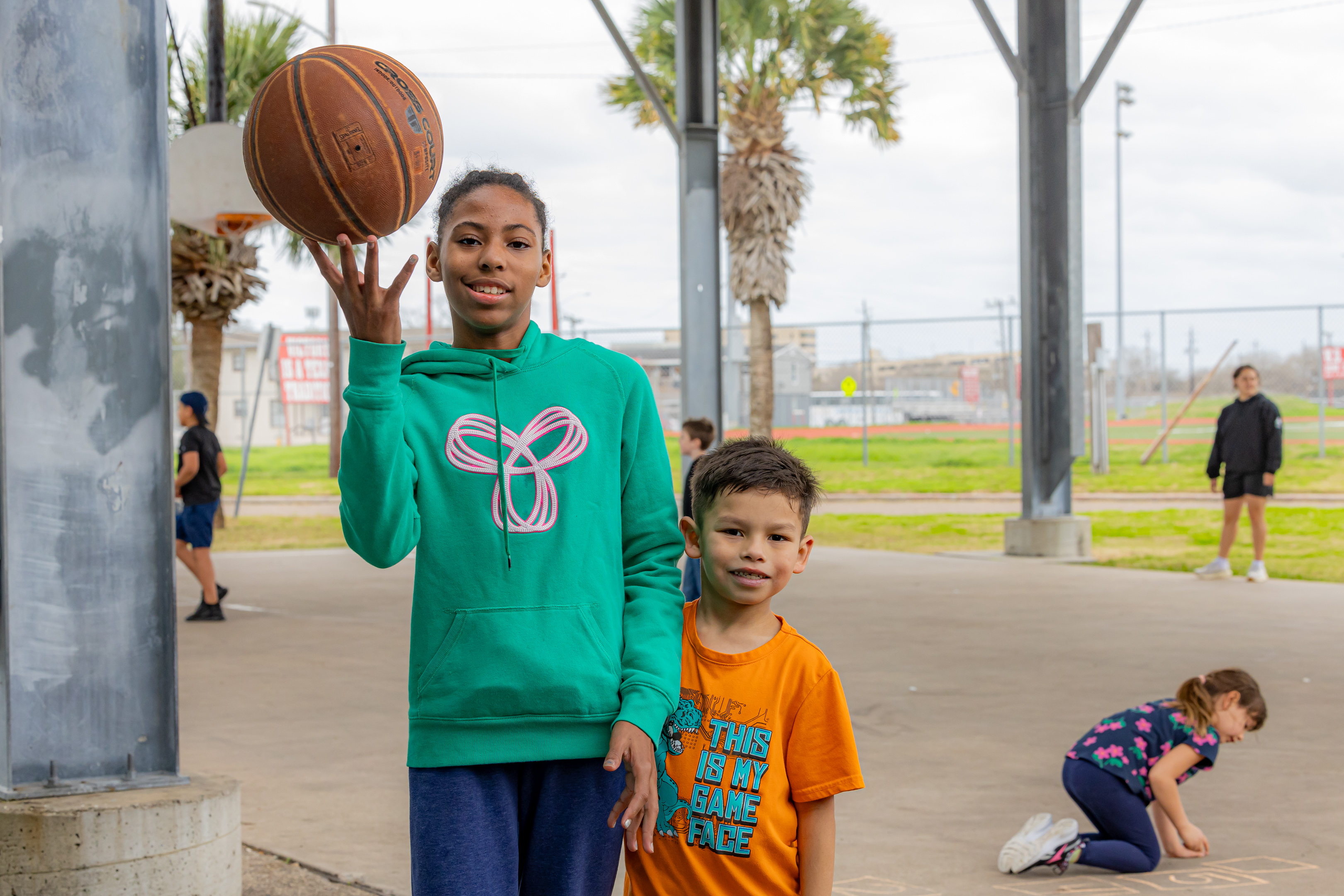 girl and boy with basketball