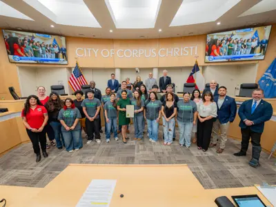 Volunteers pose with the Mayor Paulette M. Guajardo
