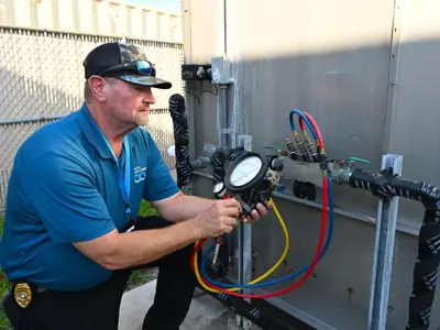 Employee checking water meter