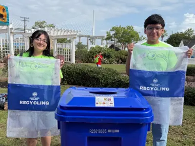 Two volunteers at a recycling event